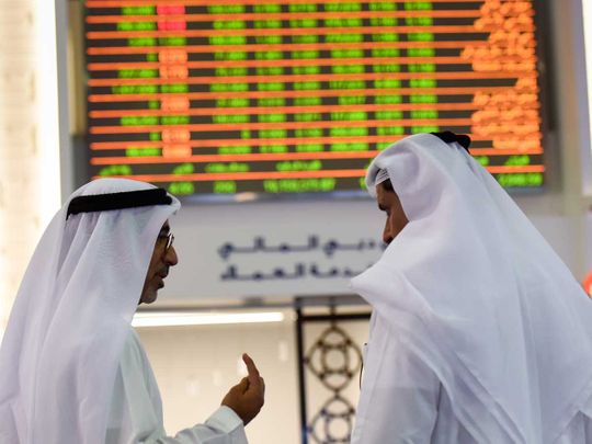 Traders at the Dubai Financial Market (DFM)