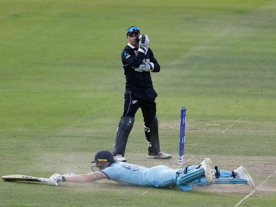 England's Ben Stokes dives in to make his ground