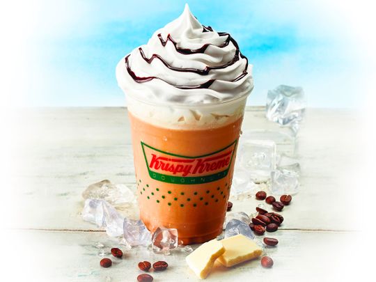Krispy Kreme's new White Chocolate Frappe with whipped cream and chocolate syrup