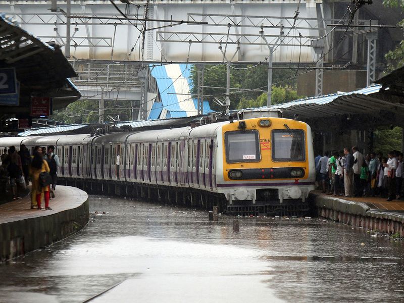 A train stands on a waterlogged track in Mumbai