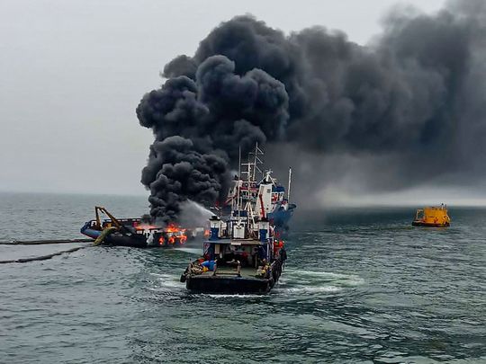 Indian Coast Guard personnel douse the fire