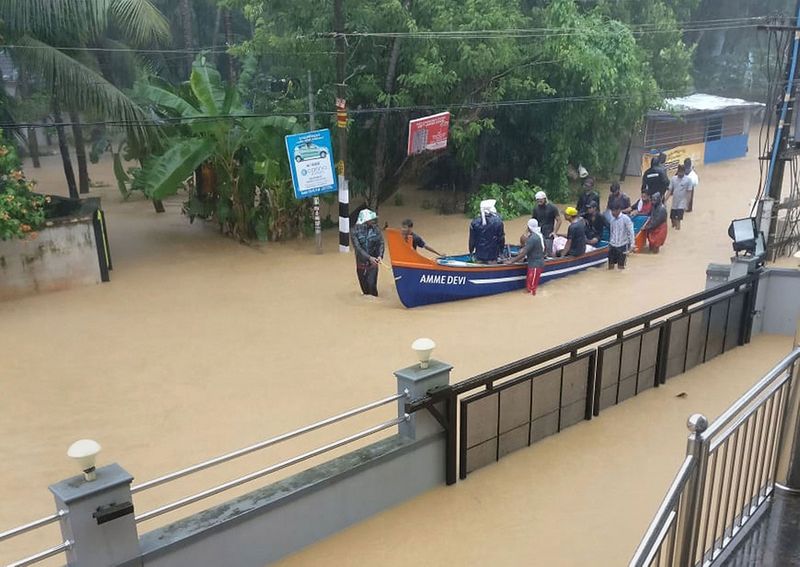 Rescue workers carry out relief and rescue operation at Olavanna