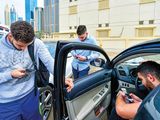 Dubai residents on their smartphones