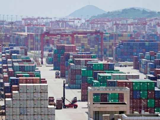 Containers are seen at the Yangshan Deep Water Port in Shanghai, China August 6