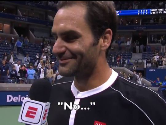 Federer answers a question post match with S. Negal