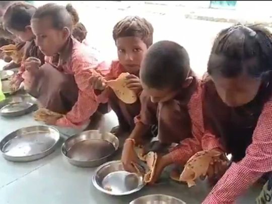 UP, children eating roti