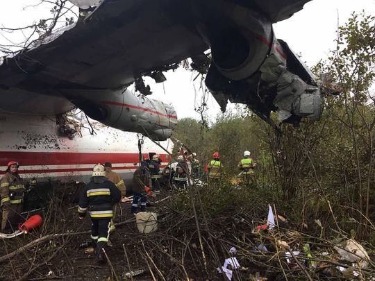 Rescuers at the plane crash site in a forest outside Lviv 