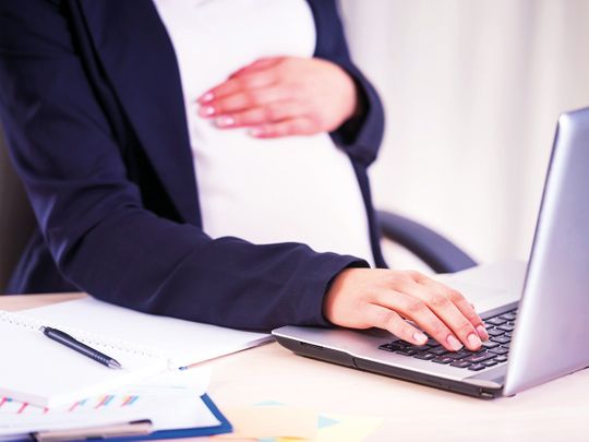 A pregnant woman at work