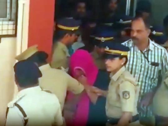 Jolly Joseph being escorted out of the Thamarassery court