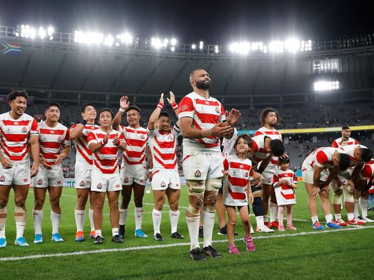 Japan applaud their fans after defeat to South Africa.