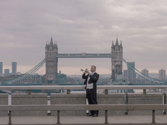 Expo 2020 - National Day Video 2019 - British trumpeter Paul Spong in front of Tower Bridge in London-1575184699859