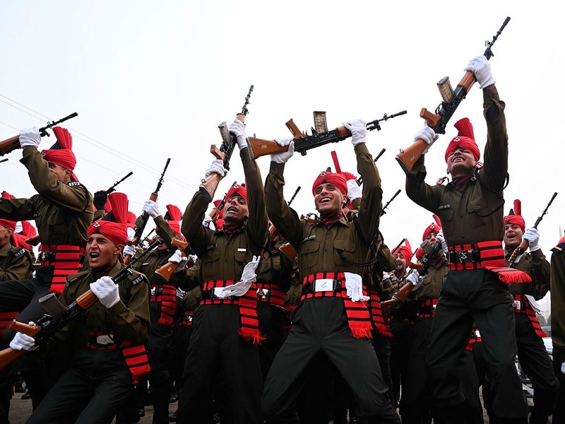Newly recruited Indian army soldiers from the Jammu and Kashmir Light Infantry (JAKLI)  celebrate during a passing out parade at JAKLI army headquarter in Srinagar