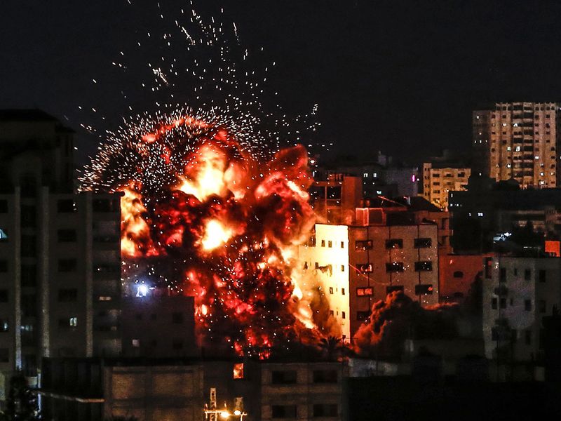 An explosion is pictured among buildings during an Israeli airstike on Gaza City on May 4, 2019. 