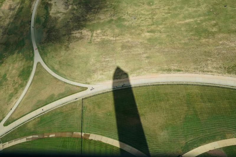 The shadow of the Washington Monument is seen on the lawn of the National Mall from the top of the monument in Washington, September 18, 2019.