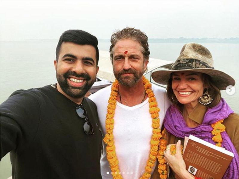 Gerard Butler with devotees and pilgrims in Rishikesh.