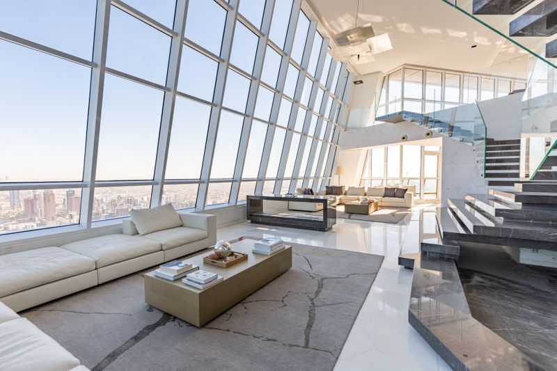 PW-200113_most expensive penthouse_The 20 feet high ceiling offers panoramic views of the ocean with an Armani Grey marble staircase-1578901152643
