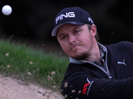 England's Eddie Pepperell plays a bunker shot on the 10th hole during the second round of the Dubai Desert Classic.