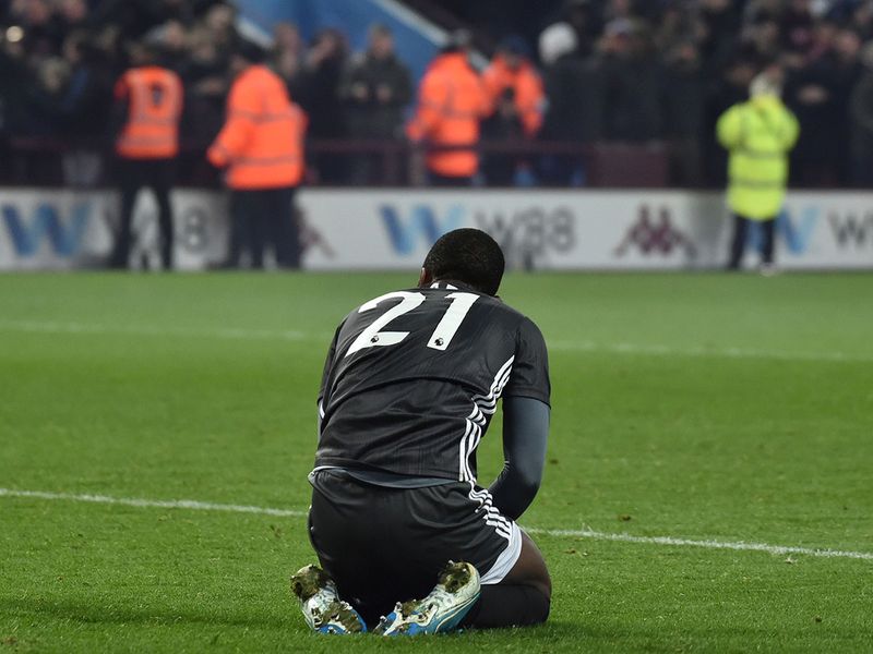 Leicester's Ricardo Pereira sits on the ground after the end of the English League Cup semifinal 