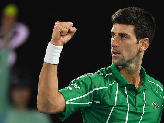 Serbia's Novak Djokovic celebrates a point against Austria's Dominic Thiem during their Australian Open men's singles final 