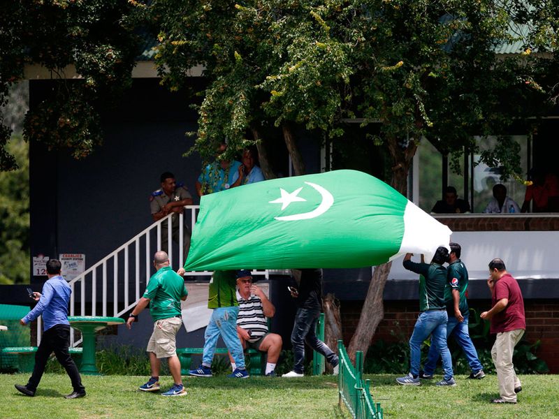 Pakistan supporters hold up a big Pakistan national flag during the match.  