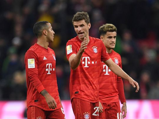 Soccer Football - Bundesliga - Bayern Munich v RB Leipzig - Allianz Arena, Munich, Germany - February 9, 2020  Bayern Munich's Thiago and Thomas Muller after the match  REUTERS/Andreas Gebert  DFL regulations prohibit any use of photographs as image sequences and/or quasi-video