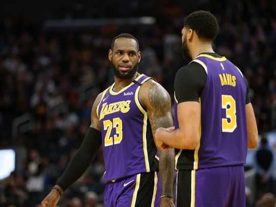 Los Angeles Lakers forward LeBron James (23) talks with center Anthony Davis