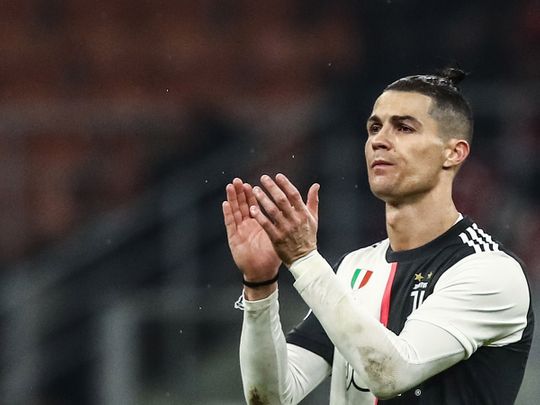 Juventus' Portuguese forward Cristiano Ronaldo acknowledges the public at the end of the Italian Cup (Coppa Italia) semi-final first leg football match AC Milan vs Juventus Turin on February 13, 2020 at the San Siro stadium in Milan. / AFP / Isabella BONOTTO