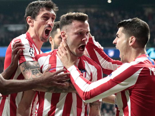 Atletico Madrid's Saul, second from right, celebrates after scoring his side's first goal during a first leg, round of 16, Champions League soccer match between Atletico Madrid and Liverpool at the Wanda Metropolitano stadium in Madrid, Spain, Tuesday Feb. 18, 2020. (AP Photo/Bernat Armangue)