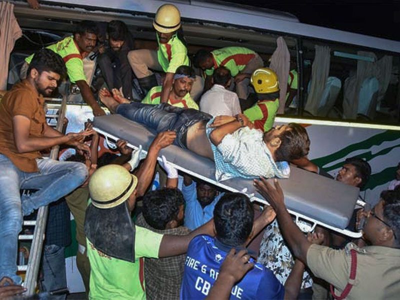 An injured passenger is rescued from a Kerala state-run bus after it collided head-on with a truck near Avanashi, Tamil Nadu. 