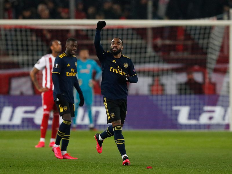 Arsenal's Alexandre Lacazette celebrates after scoring the opening goal of his team against Olympiakos 