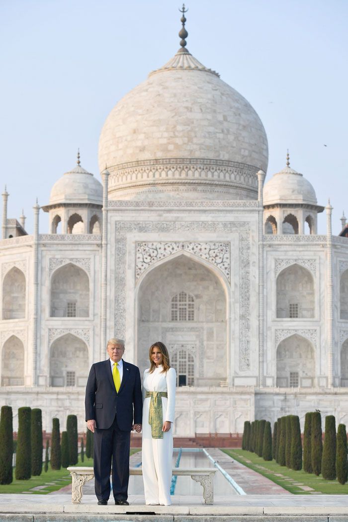 Donald Trump and Melania Trump pose as they visit the Taj Mahal in Agra.