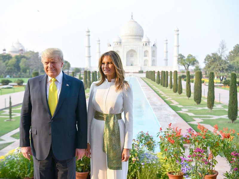 Donald Trump and Melania Trump pose as they visit the Taj Mahal in Agra. 