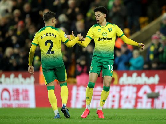 Norwich City's Jamal Lewis celebrates scoring their first goal with Max Aarons 