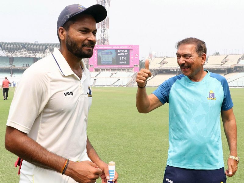 Bengal coach Arun Lal and Mukesh Kumar after Bengal defeated Karnataka by 174 runs to enter their first Ranji Trophy final in 13 years at the Eden Gardens