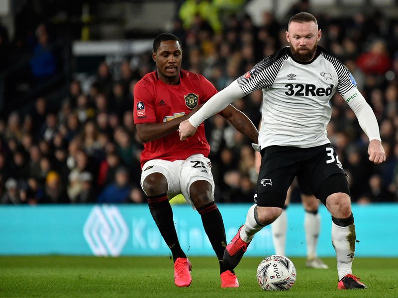 Wayne Rooney in action for Derby County against Manchester United