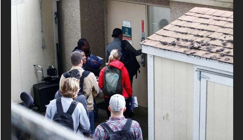 A group of people carrying medical scrubs 