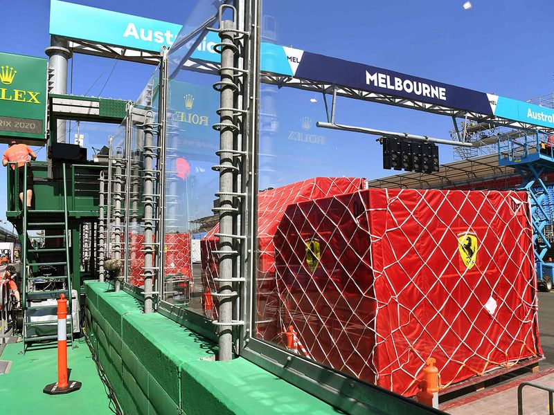 Ferrari unpack equipment at the Albert Park circuit in Melbourne ahead of the Formula One Australian Grand Prix