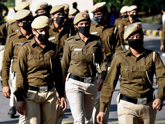 Women Security personnel wear masks to protect themselves, following an outbreak of the coronavirus disease, in New Delhi on Monday.