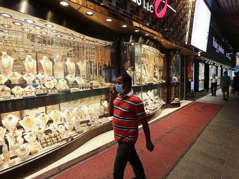 A man wearing a protective face mask as a preventive measure against coronavirus disease (COVID-19), walks at the Deira Gold Souq in Dubai, United Arab Emirates, March 18, 2020.