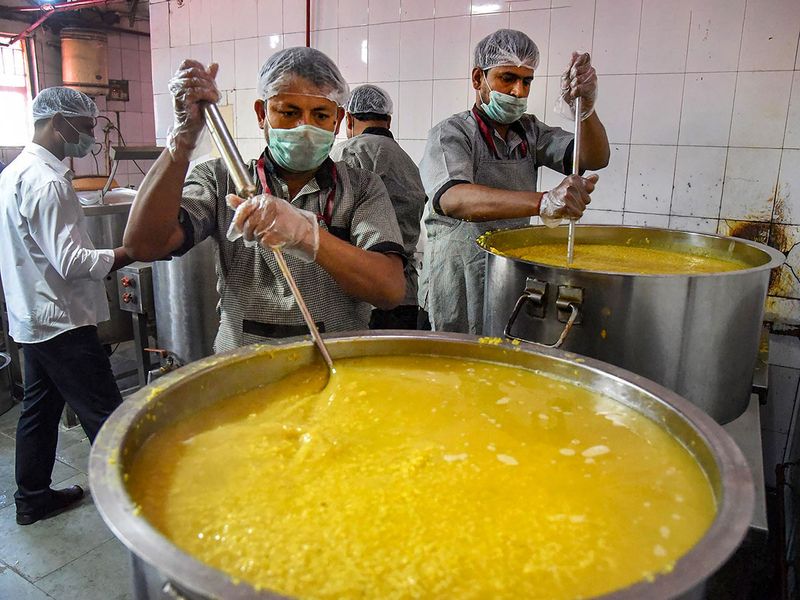 Indian Railway Catering and Tourism Corporation (IRTC) staff cooks food for homeless and poor people during a nationwide lockdown in the wake of coronavirus pandemic, at Patna Junction campus, in Patna.