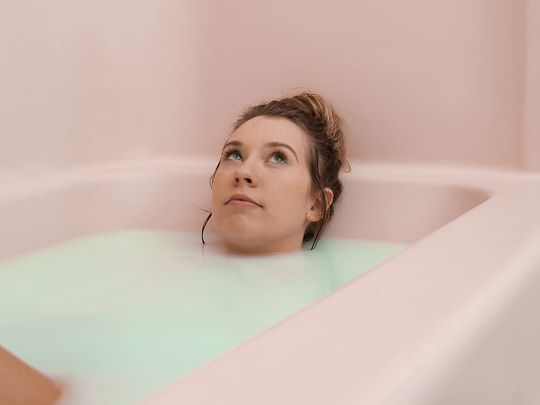 Beauty routine, woman in bathtub