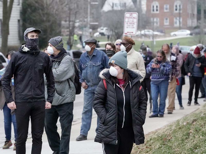 Long lines and drivethrough voting as Wisconsin residents brave COVID