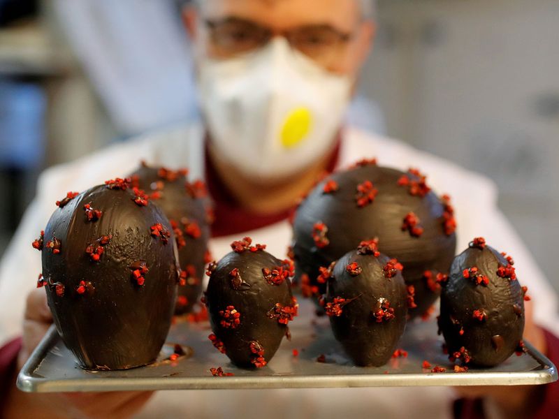 French chocolate maker Jean-Francois Pre displays Easter eggs shaped as coronavirus in his pastry shop ahead of Easter celebrations in Landivisiau, as the spread of the coronavirus disease (COVID-19) continues in France. 