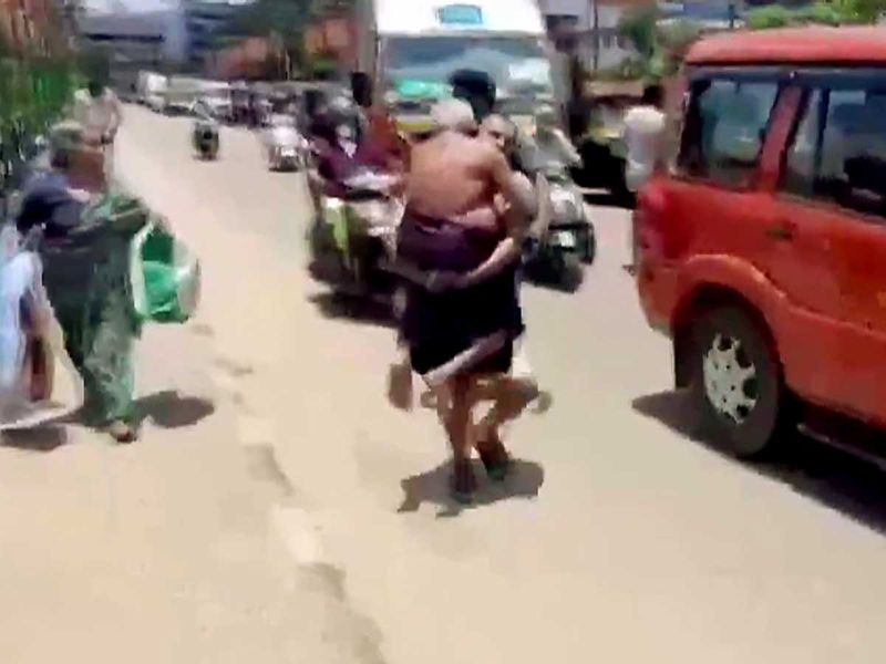 Kerala man carries father punalur