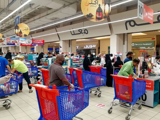 Customers queue to pay for groceries at a supermarket during a nationwide curfew to stem the spread of COVID-19 in the Saudi capital Riyadh, ahead of Ramadan. From cancelled iftar feasts to suspended mosque prayers, Muslims across the Middle East are bracing for a bleak month of Ramadan fasting as the pandemic lingers.