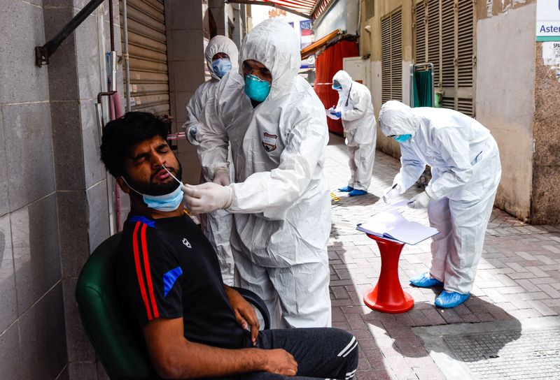 Healthcare workers conduct coronavirus testing in Dubai's Naif district