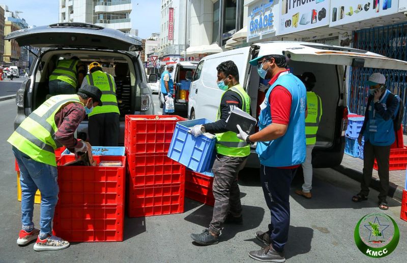 Haska Choori seen here on the right helping with volunteering efforts in Naif