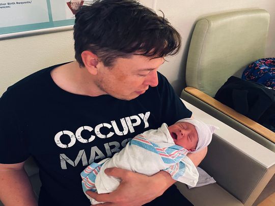 Elon Musk with his baby