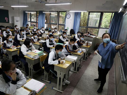 COVID-19: Students in China's virus centre Wuhan return to school ...