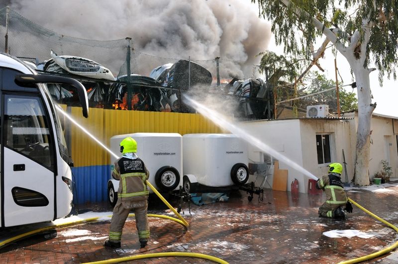 Pictures from the scene of Saturday's fire in Dubai's Umm Ramool area show a single storey contracting firm and car park ablaze